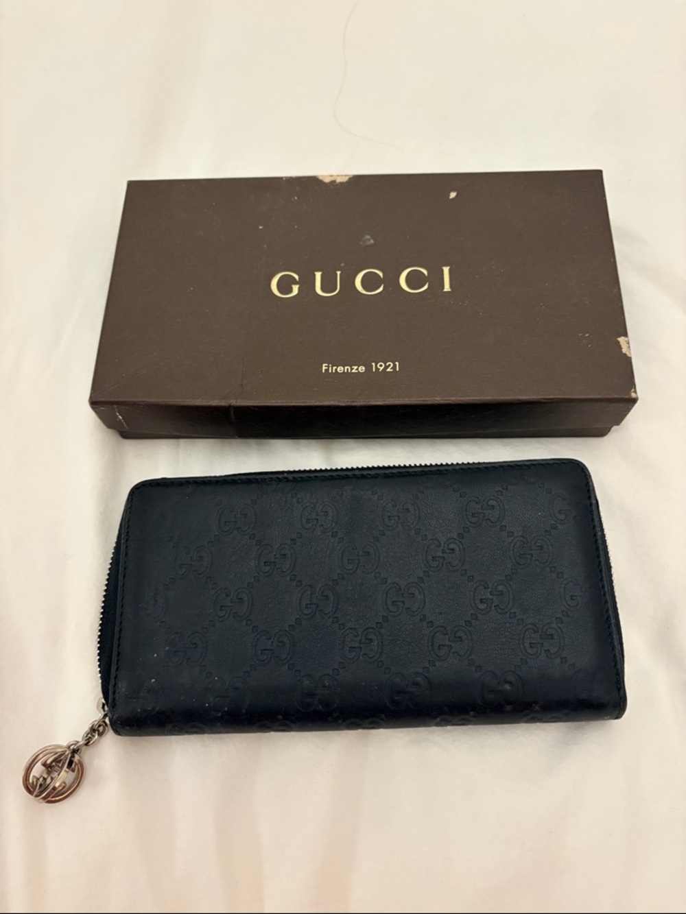 Gucci Black GG Embossed Zip Wallet with Logo Charm